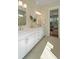 Bright bathroom with double vanity, quartz countertop, and elegant fixtures, seamlessly connecting to bedroom at 4155 Jean Laffite Rd, Hollywood, SC 29449