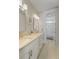 Elegant bathroom featuring double vanity, light fixtures, and an open door to a tub shower with an inviting design at 4155 Jean Laffite Rd, Hollywood, SC 29449