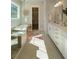 Bright bathroom featuring a soaking tub, walk-in shower with glass door, and a spacious vanity with elegant fixtures at 4155 Jean Laffite Rd, Hollywood, SC 29449