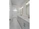 Modern bathroom featuring double vanity, stylish mirrors, and sleek lighting, creating a luxurious and functional space at 4155 Jean Laffite Rd, Hollywood, SC 29449