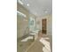 Bright and spacious bathroom features a glass-enclosed shower, soaking tub, and direct access to a large walk-in closet at 4155 Jean Laffite Rd, Hollywood, SC 29449