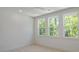 Bedroom featuring three large windows and plush carpeting at 4155 Jean Laffite Rd, Hollywood, SC 29449