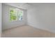 Bright, carpeted bedroom with large window providing natural light, offering a comfortable and inviting living space at 4155 Jean Laffite Rd, Hollywood, SC 29449