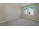 Bright bedroom with a neutral color palette, ceiling fan, and a large window offering ample natural light at 4155 Jean Laffite Rd, Hollywood, SC 29449