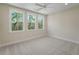 Bright, neutral bedroom featuring three large windows and plush carpeting at 4155 Jean Laffite Rd, Hollywood, SC 29449