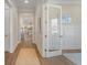 Inviting hallway featuring hardwood floors and stylish decor, leading to other rooms at 4155 Jean Laffite Rd, Hollywood, SC 29449