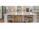 Kitchen island with seating offers space for dining and entertaining with modern design at 4155 Jean Laffite Rd, Hollywood, SC 29449
