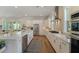 Modern kitchen featuring white cabinets, stainless steel appliances, and a center island at 4155 Jean Laffite Rd, Hollywood, SC 29449