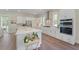 Spacious kitchen with island, white cabinets, stainless steel appliances and modern design at 4155 Jean Laffite Rd, Hollywood, SC 29449