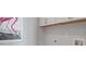 Bright laundry room featuring white cabinets, decor, and pink flamingo art at 4155 Jean Laffite Rd, Hollywood, SC 29449