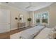 Bright bedroom with hardwood floors, large window, and neutral tones, offering a serene retreat at 4155 Jean Laffite Rd, Hollywood, SC 29449