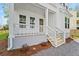 Charming front porch with white railings and steps, adding curb appeal to the home at 4155 Jean Laffite Rd, Hollywood, SC 29449