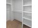Walk-in closet with custom shelving and ample storage space for organization at 4155 Jean Laffite Rd, Hollywood, SC 29449