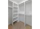 Spacious walk-in closet with ample shelving and rods for clothing and storage at 4155 Jean Laffite Rd, Hollywood, SC 29449