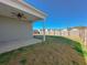 Expansive backyard featuring a covered patio with ceiling fan and a wooden fence at 434 Pender Woods Dr, Summerville, SC 29486