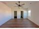 Spacious bedroom with a ceiling fan, two entry doors, and a bright window at 434 Pender Woods Dr, Summerville, SC 29486