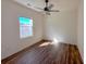 Cozy bedroom featuring ceiling fan, hardwood floors, and bright natural lighting at 434 Pender Woods Dr, Summerville, SC 29486