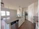 A bright kitchen with granite counters, stainless appliances and a view into the living room at 434 Pender Woods Dr, Summerville, SC 29486