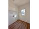 Bright laundry room features wood flooring and a window with natural light at 434 Pender Woods Dr, Summerville, SC 29486