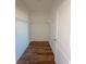 A walk-in closet features a wood floor and built-in white wire shelving at 434 Pender Woods Dr, Summerville, SC 29486