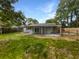 Large backyard features green grass, a concrete patio and is surrounded by a privacy fence at 4412 Abby Dr, North Charleston, SC 29418