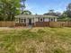 Charming single-story home features a brick foundation, light gray siding, and a well-manicured front yard at 4412 Abby Dr, North Charleston, SC 29418
