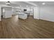 Open-concept living space flows into a bright, modern kitchen with stainless steel appliances at 4412 Abby Dr, North Charleston, SC 29418