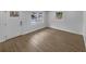 Bright living room featuring hardwood floors, neutral paint, and large windows for natural lighting at 4412 Abby Dr, North Charleston, SC 29418