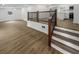 Living room area with hardwood floors and stairs to the second floor at 4412 Abby Dr, North Charleston, SC 29418