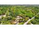 Aerial view of the home nestled among a canopy of trees in a quiet neighborhood at 4429 Highway 162, Hollywood, SC 29449