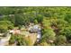A sprawling wooded neighborhood featuring a home with an in-ground pool and large private yard at 4429 Highway 162, Hollywood, SC 29449