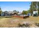 Spacious backyard with a pool, deck, trampoline, storage shed and playhouse with slide at 4429 Highway 162, Hollywood, SC 29449