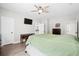 Spacious bedroom featuring a ceiling fan, a tv, hardwood floors, and ample natural light at 4429 Highway 162, Hollywood, SC 29449