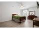 Well-lit bedroom features wood-look flooring, a ceiling fan, and neutral colors at 4429 Highway 162, Hollywood, SC 29449