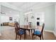 Cozy dining room with natural light from the large window and open floor plan adjacent to the kitchen at 4429 Highway 162, Hollywood, SC 29449