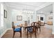Traditional dining room features a wood table, stylish chairs, modern lighting, and elegant decor at 4429 Highway 162, Hollywood, SC 29449