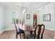 Cozy dining room with natural light from the large window with an elegant light fixture creating inviting atmosphere at 4429 Highway 162, Hollywood, SC 29449
