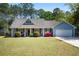 Charming single-story home featuring a well-manicured lawn and beautiful landscaping in a desirable location at 4429 Highway 162, Hollywood, SC 29449
