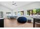 Spacious game room with a ping pong table, foosball table, and many windows providing views of the backyard at 4429 Highway 162, Hollywood, SC 29449