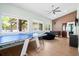 Well-lit game room featuring a ping pong table, a foosball table, and plenty of space for entertainment at 4429 Highway 162, Hollywood, SC 29449