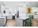 Bright kitchen featuring white cabinets, stainless steel appliances, and a convenient breakfast bar at 4429 Highway 162, Hollywood, SC 29449