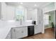 Bright kitchen featuring white cabinets, stainless steel appliances, and quartz countertops at 4429 Highway 162, Hollywood, SC 29449