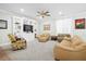 Comfortable living room features a ceiling fan, built-in shelving, neutral carpet and comfortable seating at 4429 Highway 162, Hollywood, SC 29449