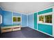 Playroom with teal and blue walls, tile floors, natural light, and a unique play table at 4429 Highway 162, Hollywood, SC 29449