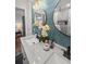 Bright bathroom featuring a double sink vanity, modern light fixtures and round mirrors at 463 E Main Street, Harleyville, SC 29448