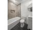 Bathroom featuring a bathtub with shower combination, toilet, and single sink vanity at 463 E Main Street, Harleyville, SC 29448