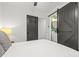 Bedroom showcasing the bathroom entrance with sliding doors adding a modern touch at 463 E Main Street, Harleyville, SC 29448