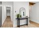 Hallway with modern console table and decor, leading into a bright, open living space at 463 E Main Street, Harleyville, SC 29448
