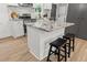 Stylish kitchen island with granite countertop, seating, and ample storage, perfect for meal preparation at 463 E Main Street, Harleyville, SC 29448