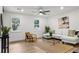Bright living room featuring large windows, modern furniture, neutral decor, and stylish accents at 463 E Main Street, Harleyville, SC 29448